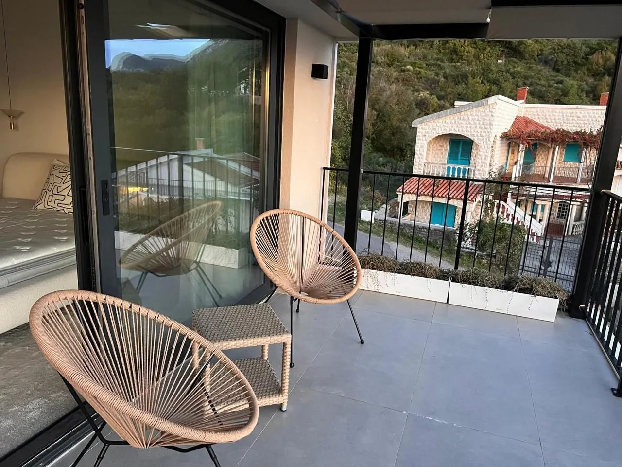 Spacious terrace with patio furniture and a view of the surroundings.