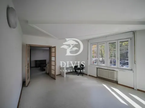 Empty room with a large window and doors leading to the adjacent room. - image 17