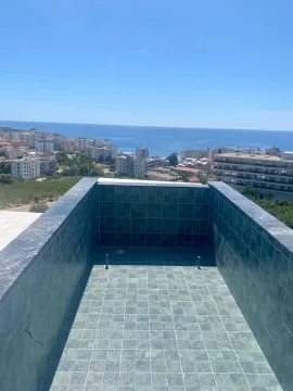 View of the city and sea from the terrace with a section of the pool. - image 4
