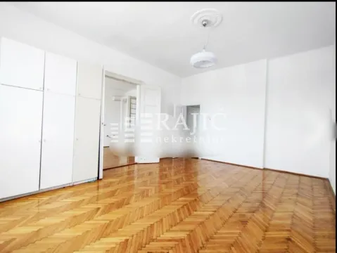 Empty room with hardwood parquet flooring and built-in closet. - image 18