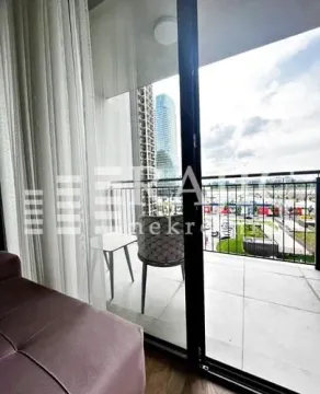 View from the balcony overlooking the city and surrounding buildings. - image 10