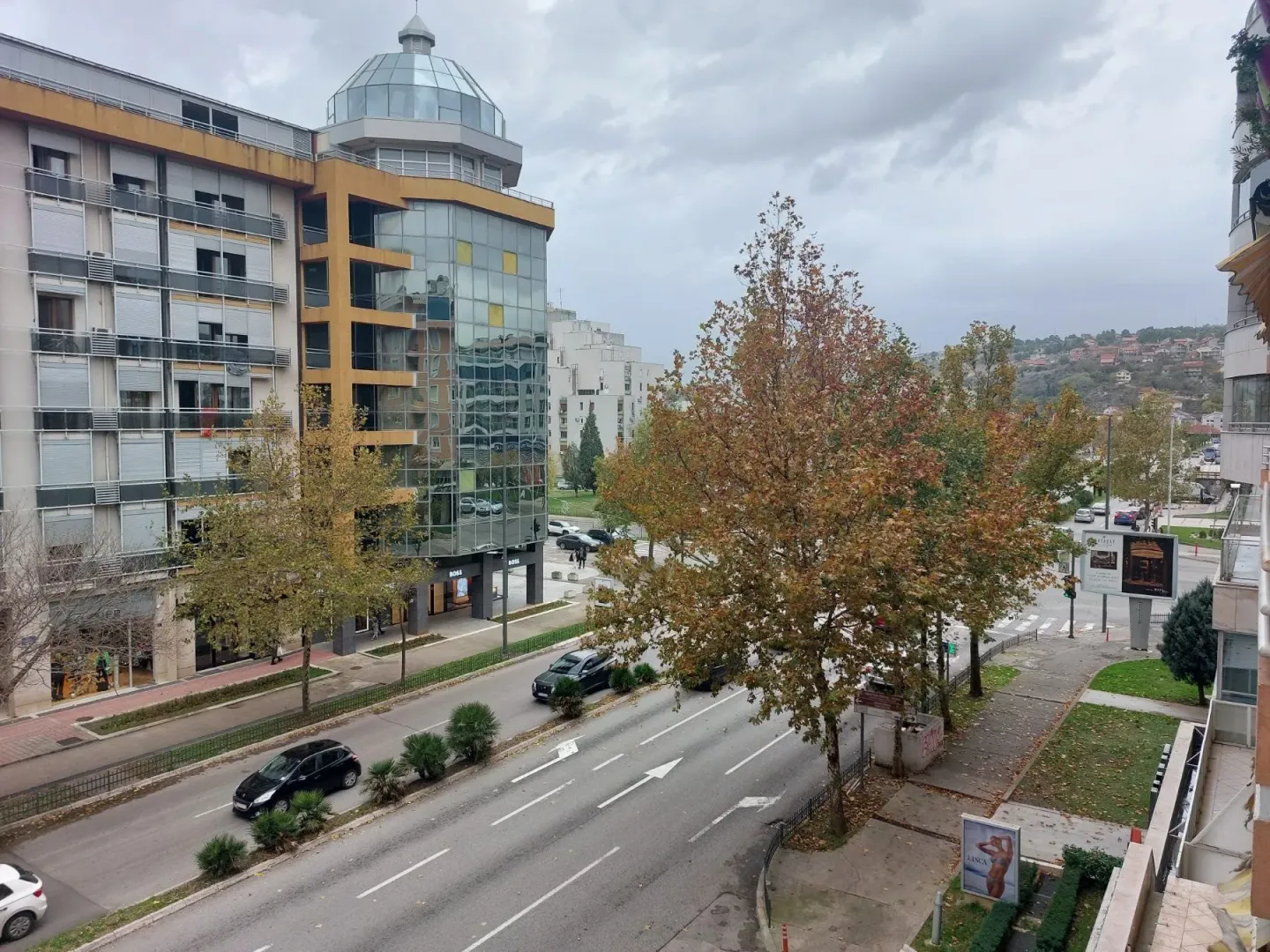 Elevated view of a city street and surrounding buildings.