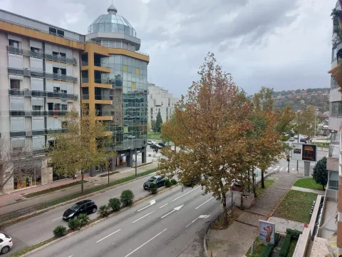 Elevated view of a city street and surrounding buildings. - image 14