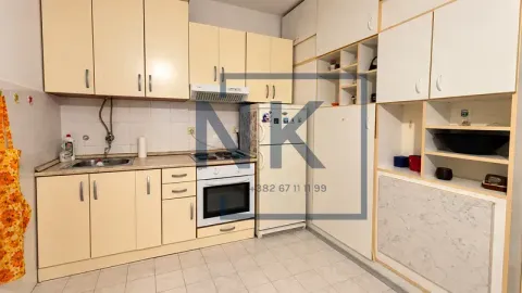 Small kitchen with light-colored cabinets, stove, refrigerator, and sink. - image 5