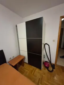 Smaller bedroom with a wardrobe and wooden flooring. - image 6
