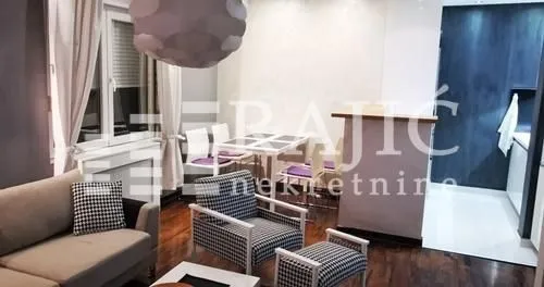 Living room with furniture and dining area.