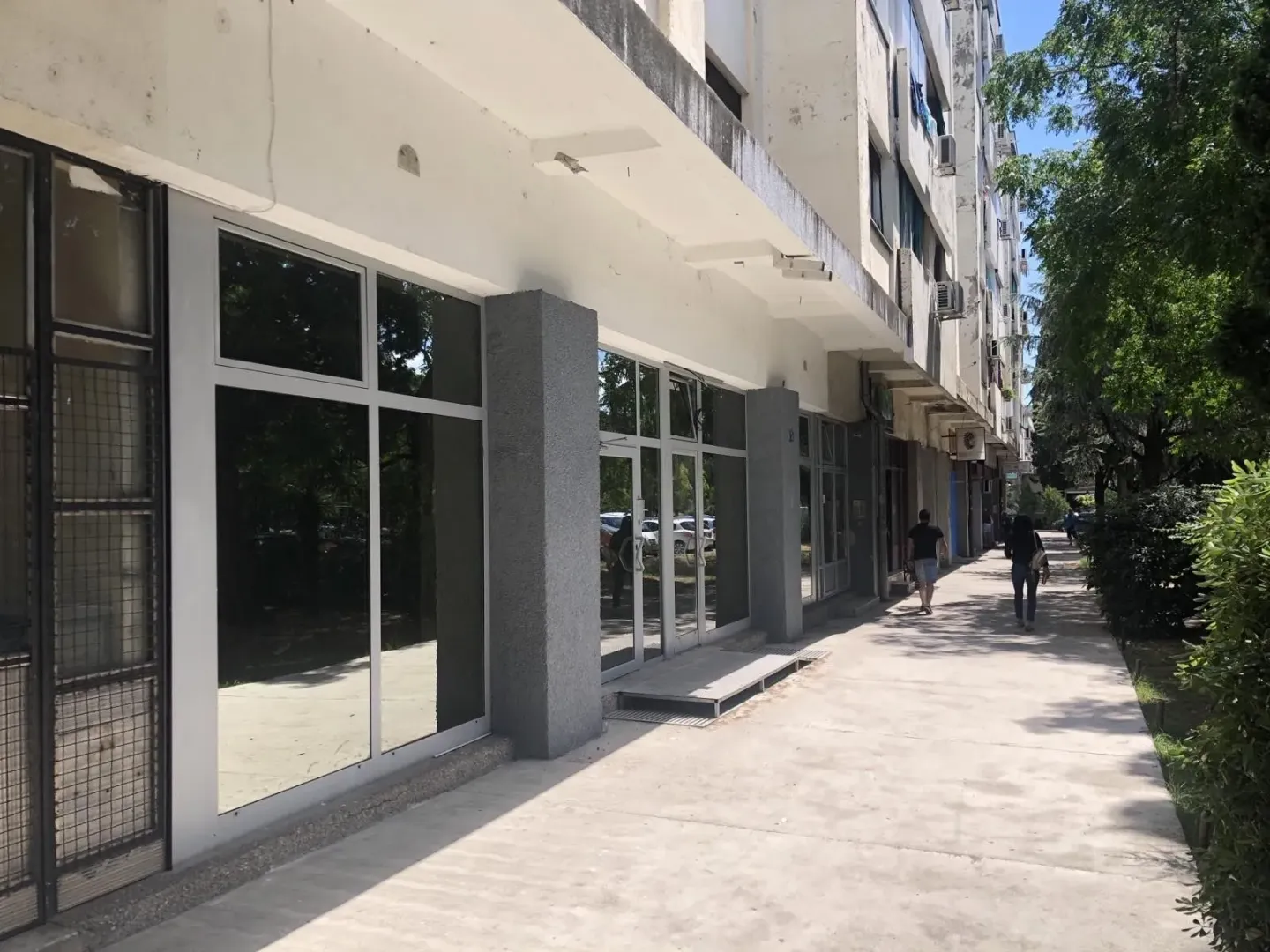 Exterior view of a commercial space on the ground floor of a building.