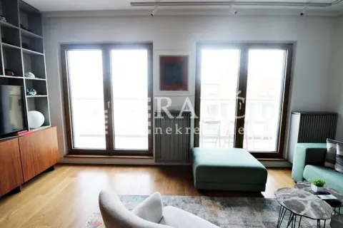 Living room with furniture and large windows. - image 6
