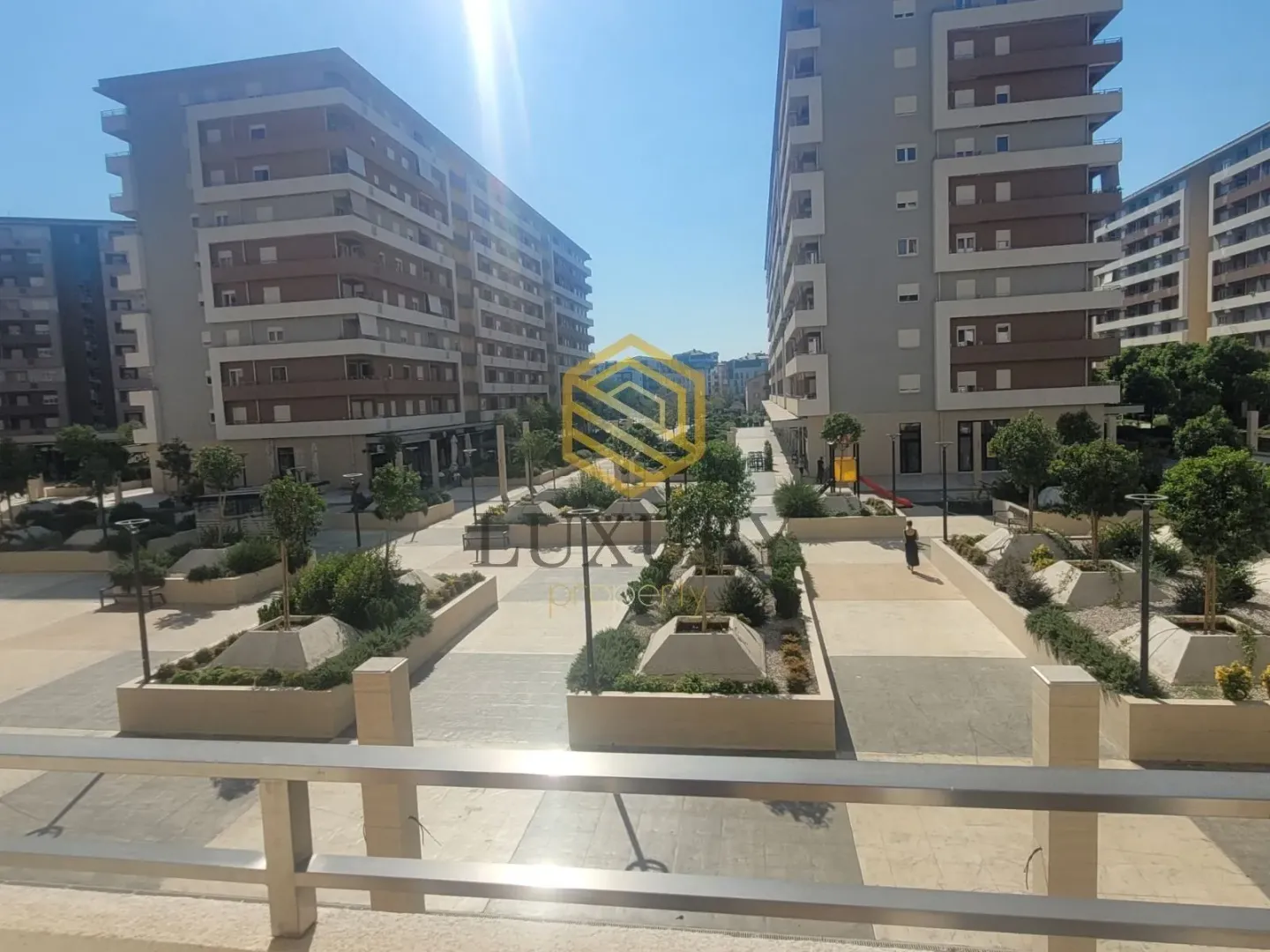 View from the terrace overlooking the courtyard and surrounding buildings.