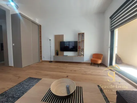 Modern living room with a TV unit and seating area. - image 3