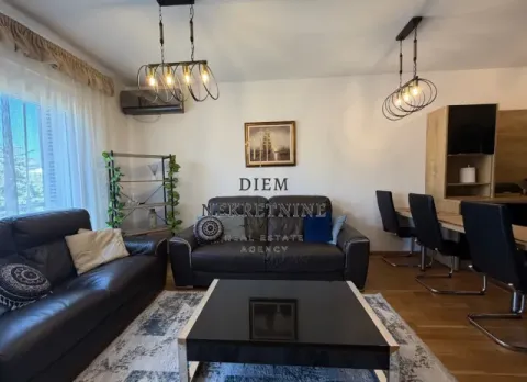 Living room with sofa set, dining table and modern lighting. - image 2