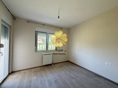 Empty room with a window and wooden flooring. - image 11