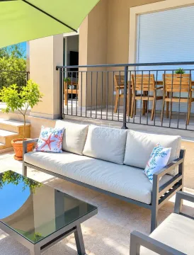 Furnished terrace with seating set and dining table. - image 5