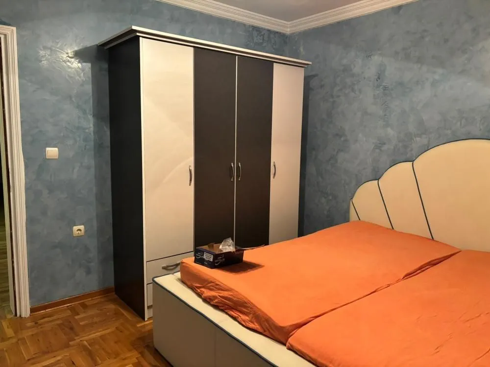 Bedroom with a double bed and a wardrobe.