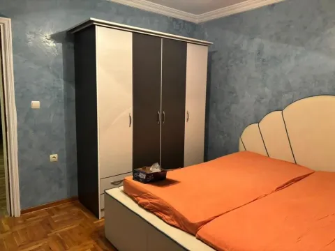 Bedroom with a double bed and a wardrobe. - image 14