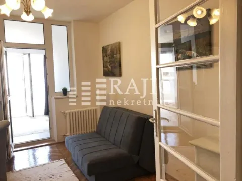 Living room with a sofa and access to the terrace. - image 3