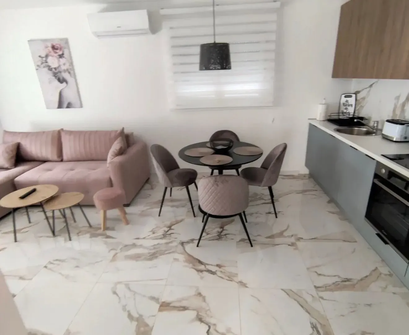 Living room with dining area and kitchen.