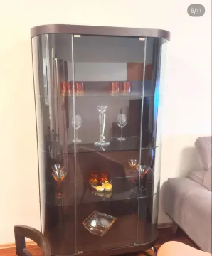 Dark glass display cabinet in the living room. - image 5