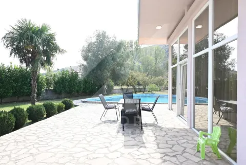 Terrace with seating furniture and a view of the pool and yard. - image 32