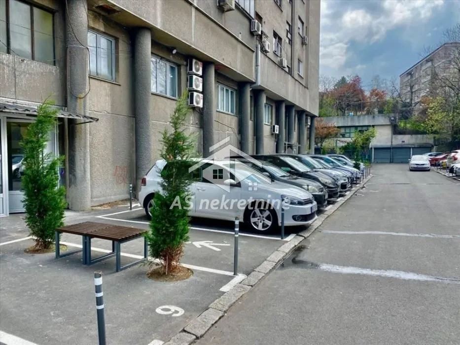 Outdoor area with parking spaces in front of the residential building.
