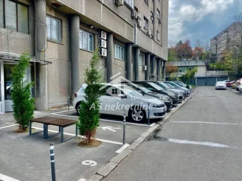 Outdoor area with parking spaces in front of the residential building. - image 11