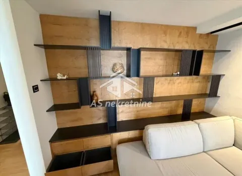 Living room with modern wooden wall shelves and a sofa. - image 3
