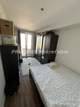 Furnished bedroom with a bed, wardrobe, and access to the terrace. - image 6