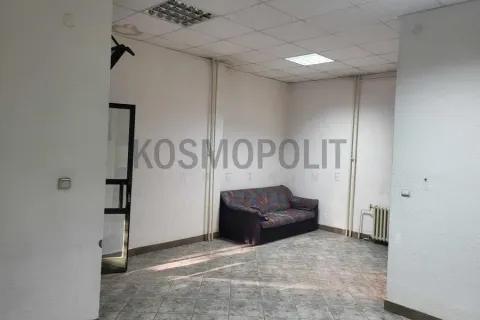 Empty room with a sofa and tiled floor. - image 3