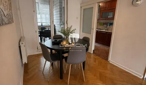 Dining area with a table, chairs, and access to the terrace. - image 4