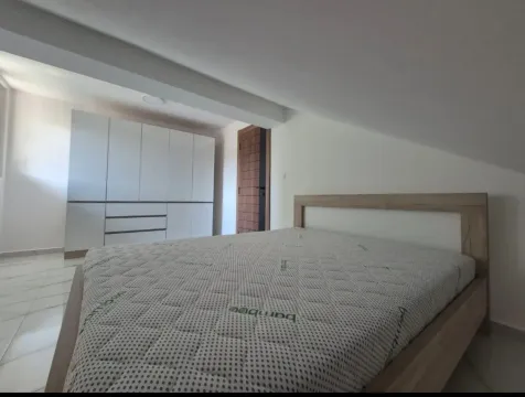 Bedroom with a double bed and a fitted wardrobe. - image 4