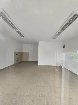 Spacious and bright empty room with tiled flooring. - image 2