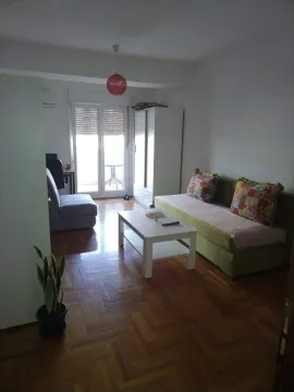 Living room with a sofa set, white coffee table, and wardrobe. - image 6