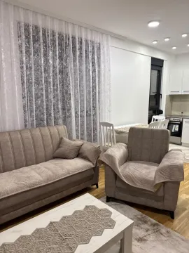 Living room with sofa set and view of the dining area and kitchen. - image 6