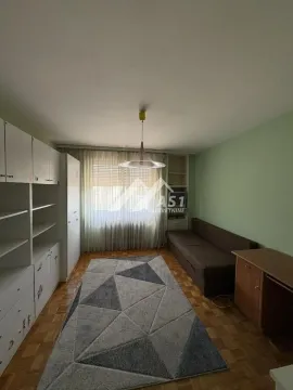 Living room with seating furniture, wardrobe and a window. - image 6