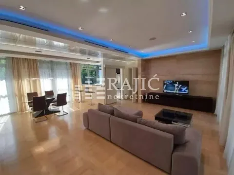 Spacious living room with sofa set and dining area. - image 11
