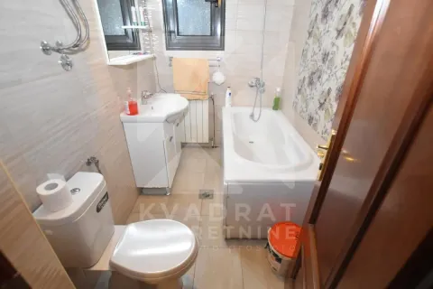 Bathroom equipped with a bathtub, sink, and toilet. - image 15