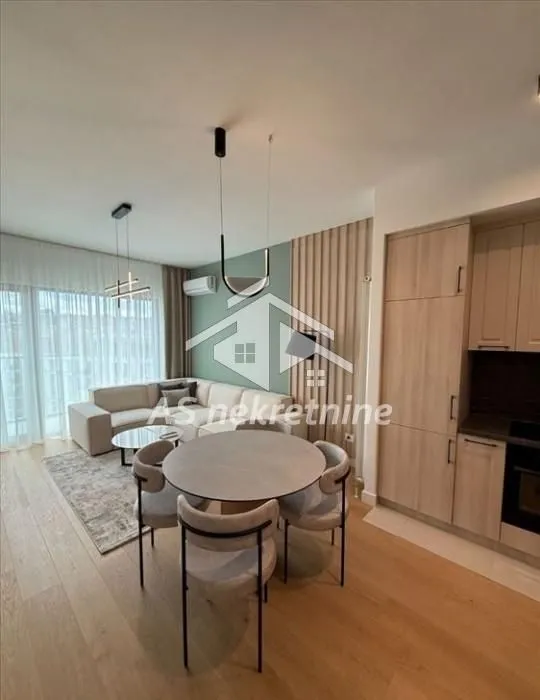 Open-plan living room with dining area and kitchen.