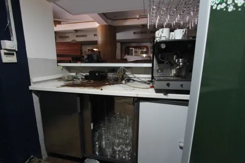 Commercial bar counter with coffee makers and glass shelves. - image 4