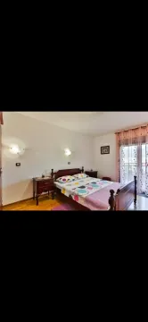 Furnished bedroom with a double bed and access to the terrace. - image 13