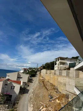 View from the terrace of the street, houses, and surrounding neighborhood near the sea. - image 6
