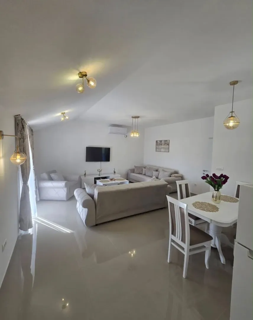 Spacious living room with dining area and modern furniture.