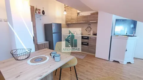 Kitchen with a dining table and chairs in the attic. - image 11
