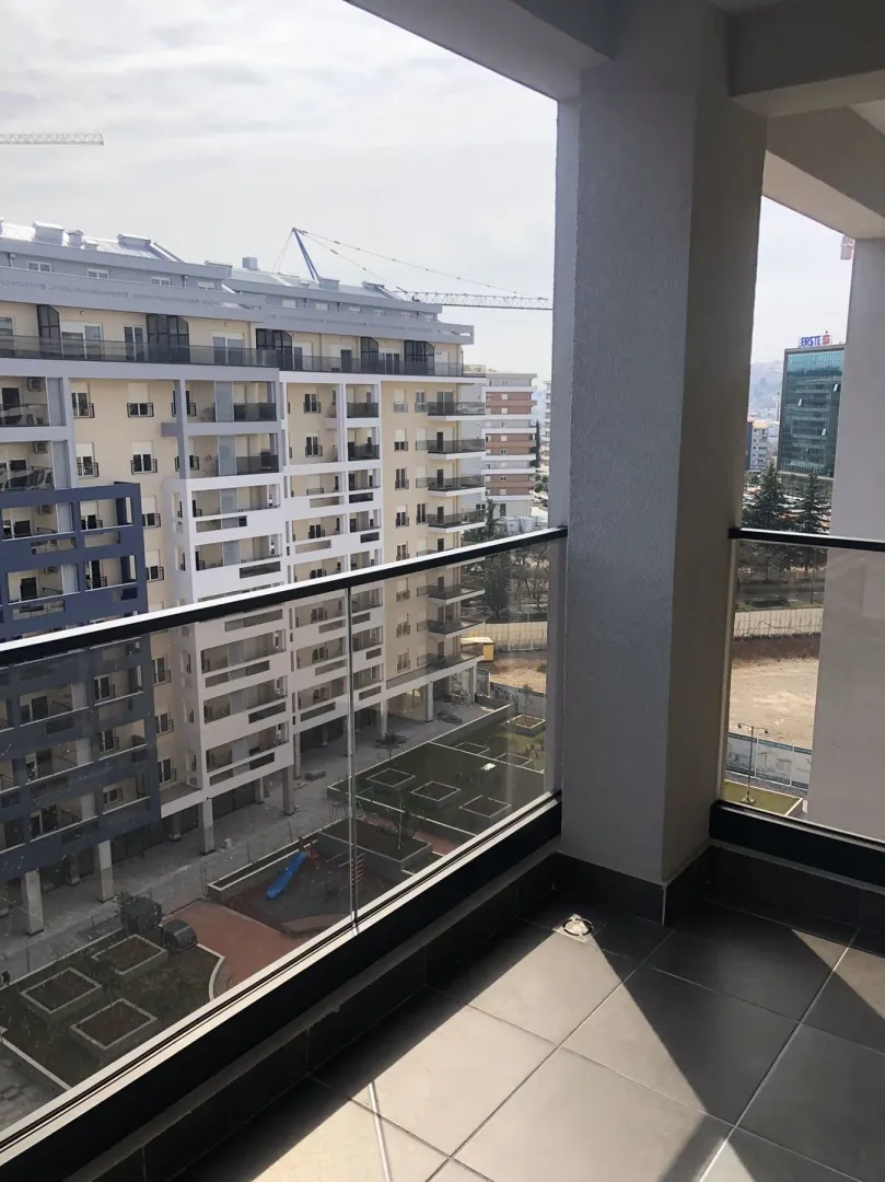 View from the balcony overlooking surrounding residential buildings.