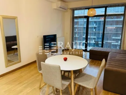 Living room with dining area and access to the terrace. - image 2