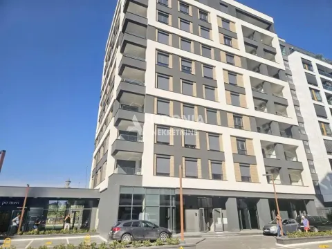Spoljašnji izgled moderne stambene zgrade sa parkingom i ulazom. - image 10