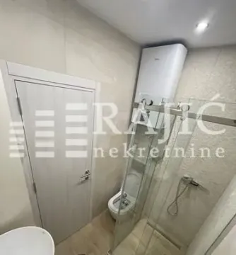 View of a modern bathroom with a walk-in shower. - image 5
