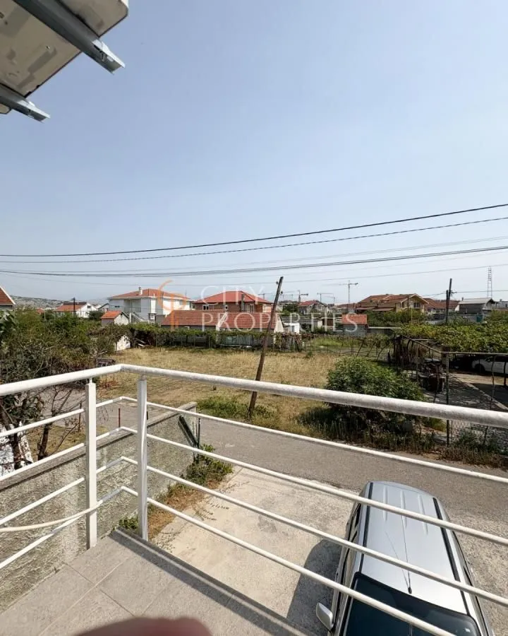 View from the terrace towards the surrounding neighborhood and yard.
