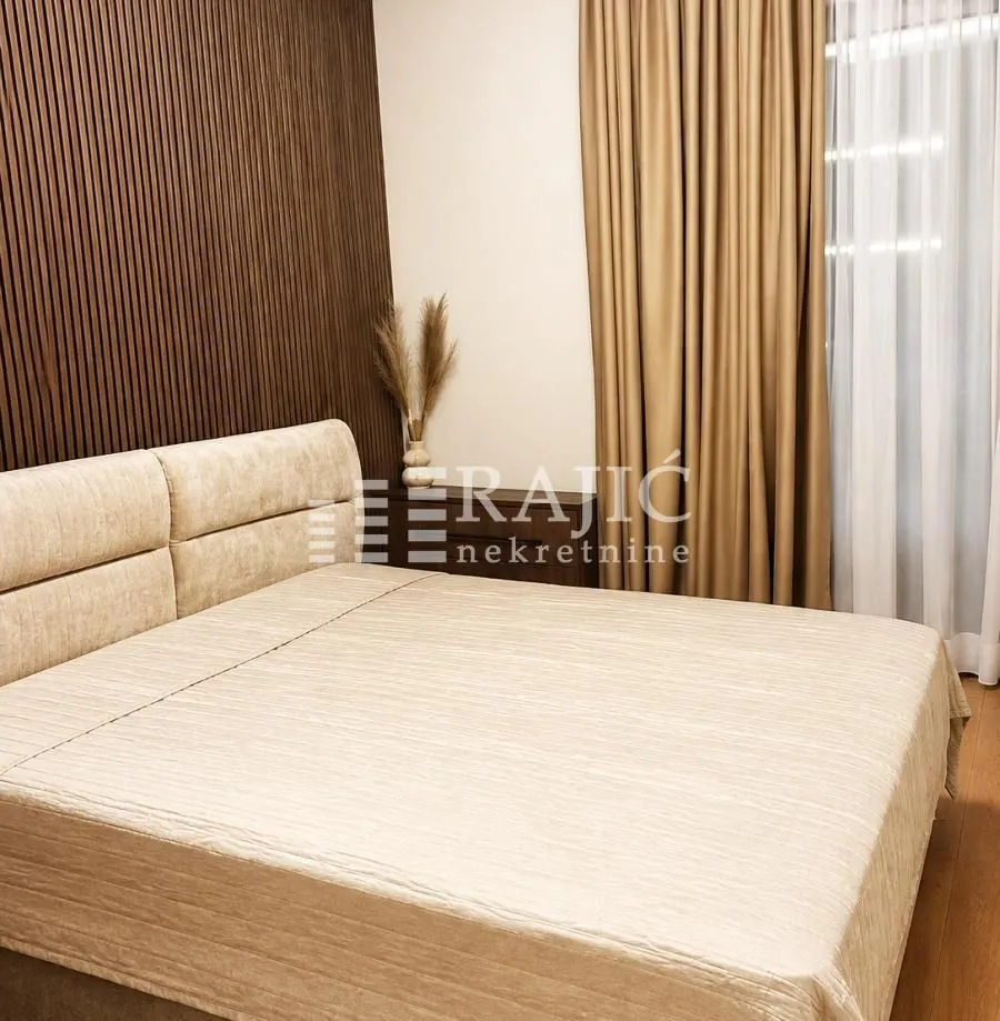 Furnished bedroom with a double bed.