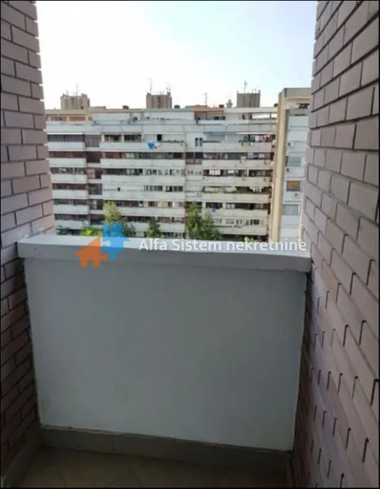 View from the balcony overlooking surrounding residential buildings.