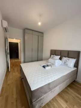 Furnished bedroom with a double bed and wardrobe. - image 4
